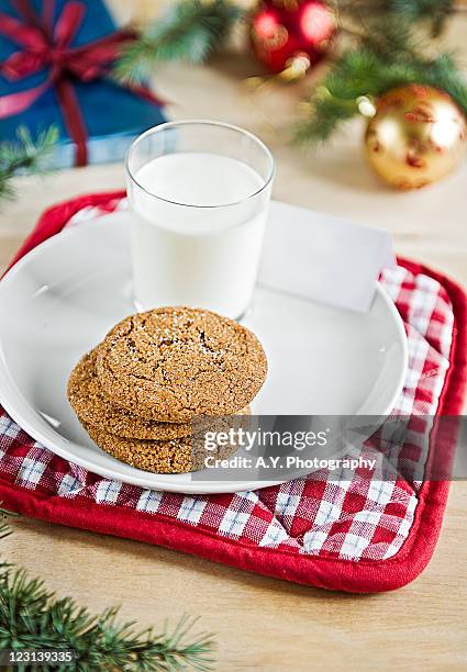 gingersnaps and milk - ginger snap stock pictures, royalty-free photos & images