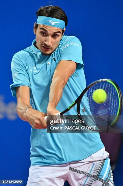 Italy's Lorenzo Senego returns the ball to Belgium's David Goffin during their singles tennis match at the Open Sud de France ATP World Tour in...