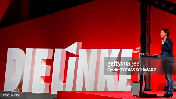 Co-leader of the left wing "Die Linke" party Katja Kipping stands next to the party's logo as she speaks on stage during the party congress in Berlin...