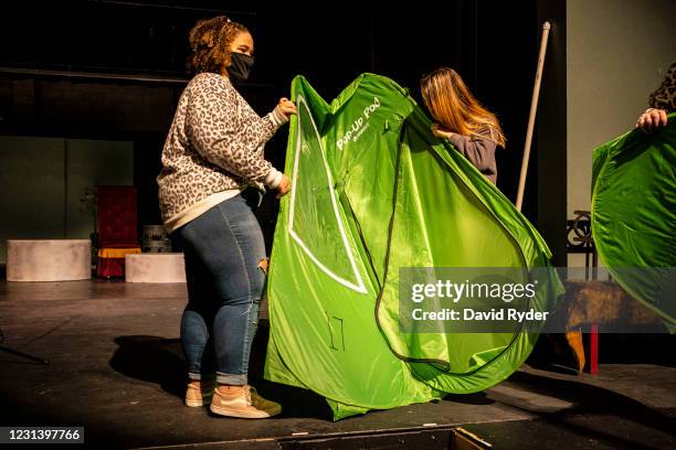 Keyonna Page-Green and other students prepare a pop-up tent during choir class at Wenatchee High School on February 26, 2021 in Wenatchee,...