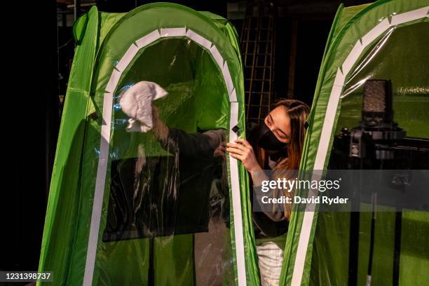 Faith Colman disinfects her pop-up tent at the end of choir class at Wenatchee High School on February 26, 2021 in Wenatchee, Washington. The school...