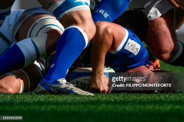 Italy's flanker Michele Lamaro holds on to the ball after being tackled during the Six Nations rugby union tournament match between Italy and Ireland...