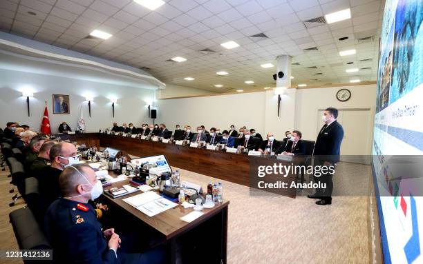 Turkish Defense Minister Hulusi Akar is being briefed during his visit to make inspections at HAVELSAN, a Turkish software and systems company having...