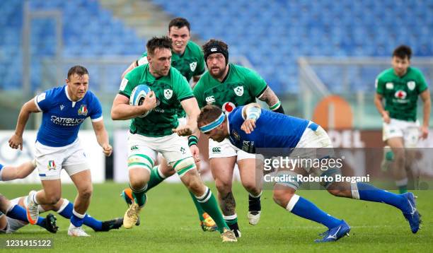 Rome , Italy - 27 February 2021; Jack Conan of Ireland is tackled by Niccolò Cannone of Italy during the Guinness Six Nations Rugby Championship...