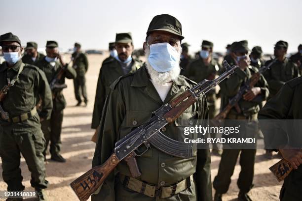 Sahrawi soldiers parade during the celebrations marking the 45th anniversary of the declaration of the Sahrawi Arab Democratic Republic , at a...