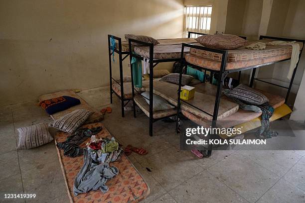 Belongings of the abducted students are pictured at the deserted dormitory of the Government Girls Secondary School, the day after the abduction of...