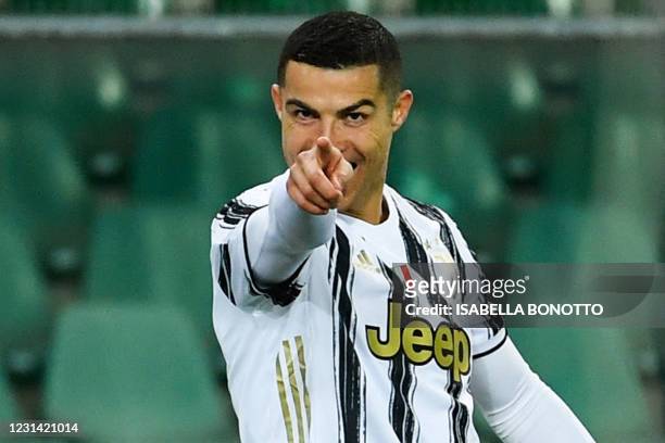 Juventus' Portuguese forward Cristiano Ronaldo celebrates after opening the scoring during the Italian Serie A football match Hellas Verona vs...