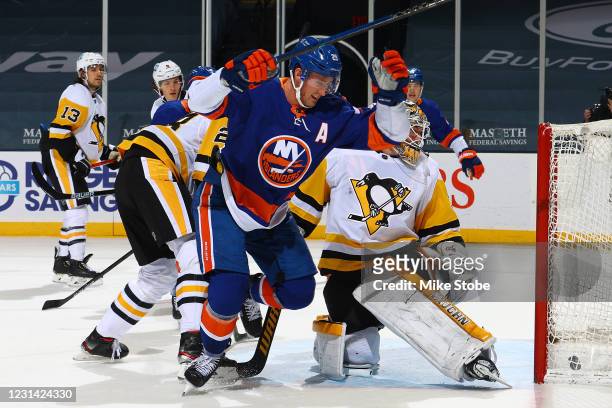 Brock Nelson of the New York Islanders scores a power-play goal past Tristan Jarry of the Pittsburgh Penguins during the first period at Nassau...