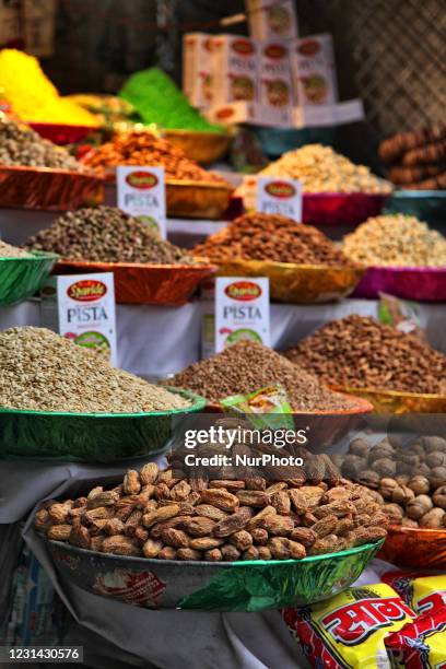 Nuts and snacks at a market food stall during Ramadan near the Jamia Masjid in Old Delhi, India.