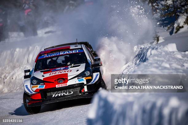 Sebastien Ogier of France and his co-driver Julien Ingrassia of France steer their Toyota Yaris WRC car during the 9th stage of the Arctic Rally...
