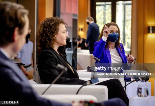 Labour Party member Henk Nijboer, Socialist Party Renske Leijten and Party for Freedom Fleur Agema prepare prior to the first television debate with...