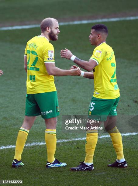 Teemu Pukki of Norwich City celebrates scoring the opening goal with Onel Hernandez during the Sky Bet Championship match between Wycombe Wanderers...