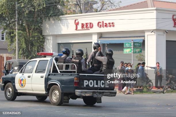 Security forces intervene in protesters as they gather to protest against the military coup in Mandalay, Myanmar on February 28, 2021.