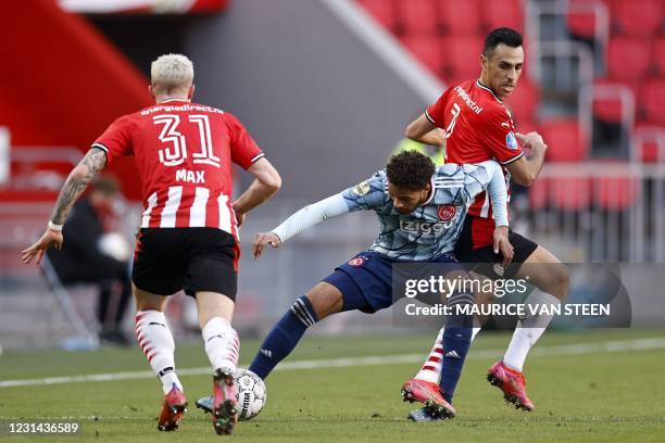 Philipp Max of PSV Eindhoven, Devyne Rensch of Ajax, Eran Zahavi of PSV Eindhoven fights for the ball during the Dutch Eredivisie match between PSV...