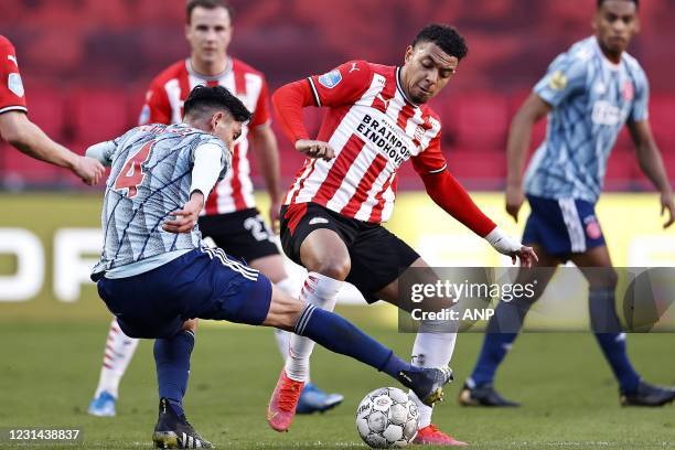 Edson Alvarez of Ajax, Donyell Malen or PSV Eindhoven during the Dutch Eredivisie match between PSV Eindhoven and Ajax Amsterdam at the Phillips...