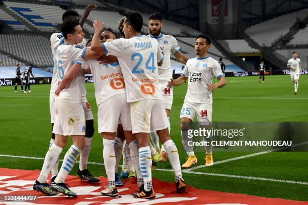 Marseille's players celebrates Marseille's Polish forward Arkadiusz Milik's goal during the French L1 football match between Olympique de Marseille...