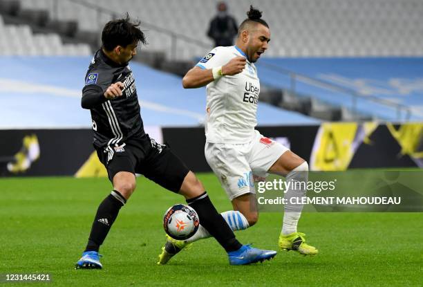 Marseille's French midfielder Dimitri Payet is fooled by Lyon's Brazilian midfielder Lucas Paqueta during the French L1 football match between...