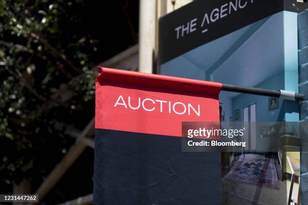 An auction sign hangs outside a residential property for sale in the Paddington suburb of Sydney, Australia, on Saturday, Feb. 20, 2021. Australia's...