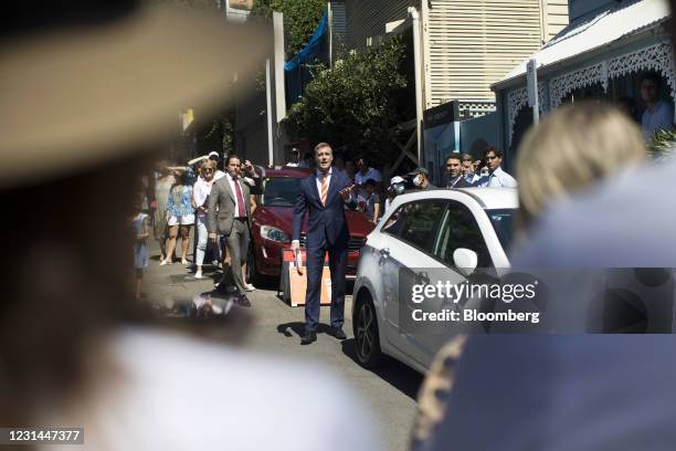 An auctioneer, center, interacts with bidders during an auction of a residential property in the Paddington suburb of Sydney, Australia, on Saturday,...