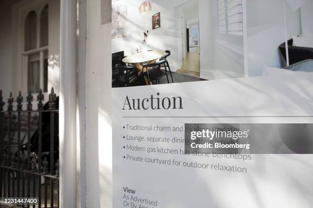 An 'auction' real estate sign outside a house in the Surry Hills suburb of Sydney, Australia, on Monday, Feb. 22, 2021. Australia's housing market is...