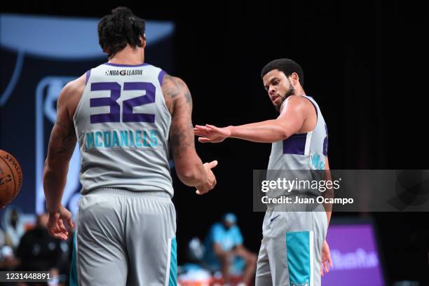 McDaniels high-fives Ray McCallum of the Greensboro Swarm during the game on February 28, 2021 at AdventHealth Arena in Orlando, Florida. NOTE TO...