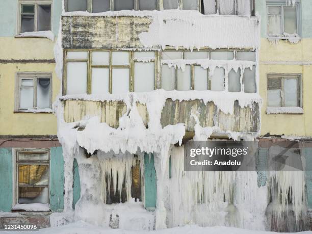 View of snow and ice covered abandoned buildings in Severny region, 17 kilometers from coal-mining town Vorkuta, Komi Republic, Russia on March 01,...