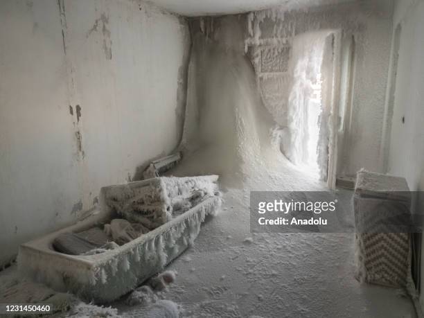 An inside view from snow and ice covered abandoned building in Sementnozavodsky region, 19 kilometers from coal-mining town Vorkuta, Komi Republic,...