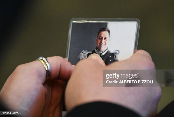 Rosa Maria Esilio, widow of slain Carabinieri military police officer Mario Cerciello Rega, looks at a photo of her husband upon her arrival for a...
