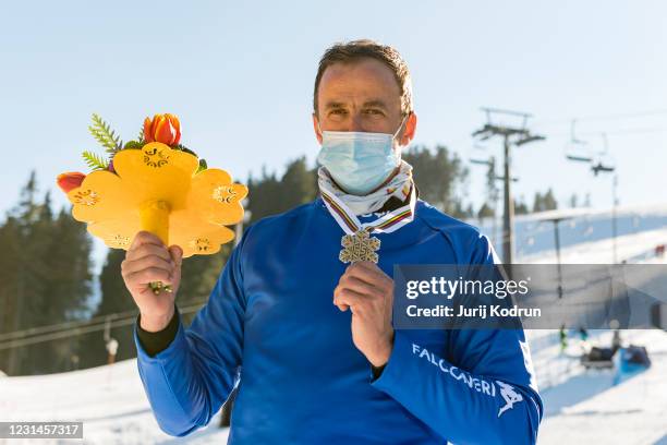 Silver medal winner Roland Fischnaller of Italy pose on the podium during the medal ceremony after the Men's parallel giant slalom at the FIS...