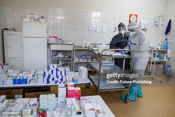 Nurse Ruslana Pataki and Ivanka Shtefaniak are seen at the Covid ward of the Regional Clinical Phthisiopulmonology Medical and Diagnostic Center ,...