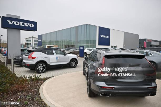 Volvo cars are seen on the forecourt of a Volvo dealership in Reading, west of London, on March 2, 2021. Chinese-owned Swedish automaker Volvo said...