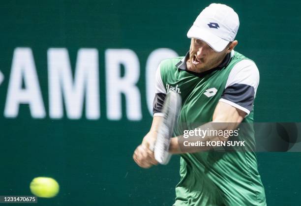 Australia's John Millman returns to compatriot Alex de Minaur on the second day of the Rotterdam ATP tennis tournament, on March 2, 2021. /...