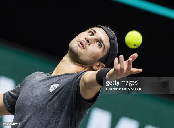S Marcos Giron serves to Russia's Andrey Rublev on the second day of the Rotterdam ATP tennis tournament, on March 2, 2021. / Netherlands OUT
