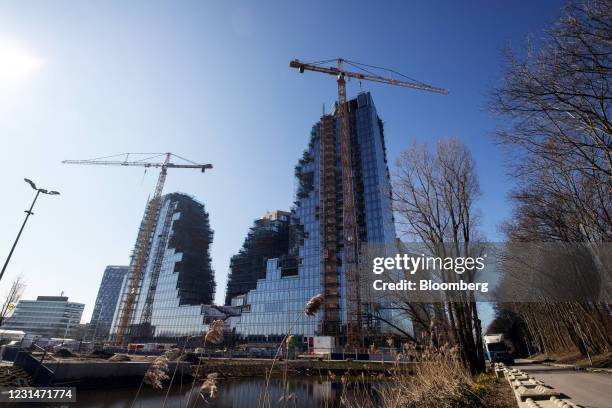 Construction cranes at the Valley residential apartment and office property in the Zuidas business district in Amsterdam, Netherlands, on Tuesday,...