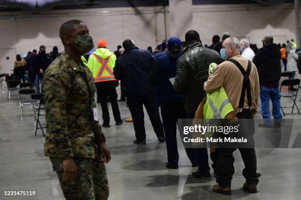 Philadelphia city employees queue to schedule their second COVID-19 vaccine shot after receiving their first at a FEMA community vaccination center...