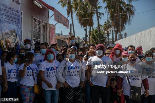 March 2021, Mexico, San Ysidro: "Biden, please let us in," reads in English on the T-shirts of a group of migrants from different backgrounds who...