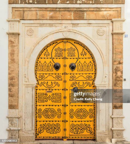 a traditional door in tunisia - tunisia medina stock pictures, royalty-free photos & images