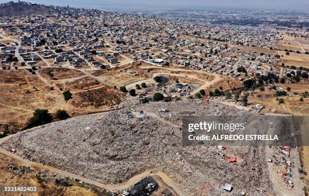 Aerial view of the municipal garbage dump and the Escalerillas neighborhood in Chimalhuacan, Mexico state, Mexico, on February 24, 2021. - The...