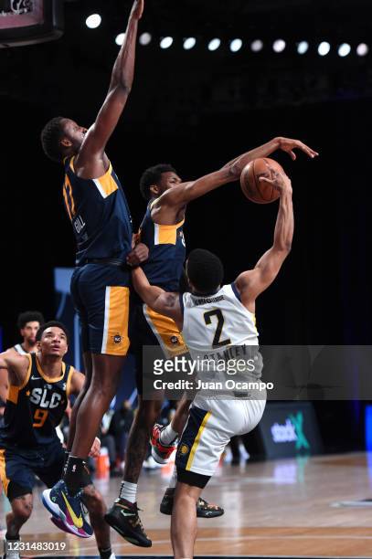 Dakarai Allen of the Salt Lake City Stars blocks shot against Cassius Stanley of the Fort Wayne Mad Ants on March 2, 2021 at AdventHealth Arena in...