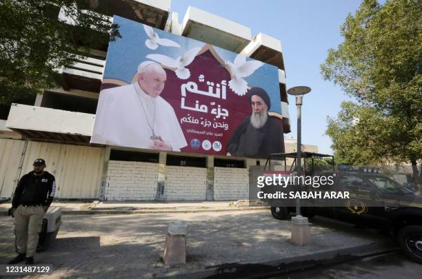 Giant billboard bears portraits of Pope Francis and Grand Ayatollah Ali Sistani in Baghdad on March 3, 2021 ahead of the first-ever papal visit to...
