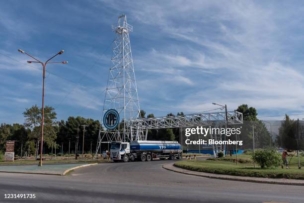 Truck leaves a YPF SA facility in Plaza Huincul, Neuquen province, Argentina, on Tuesday, March 2, 2021. YPF, Argentinas state-run oil company, needs...