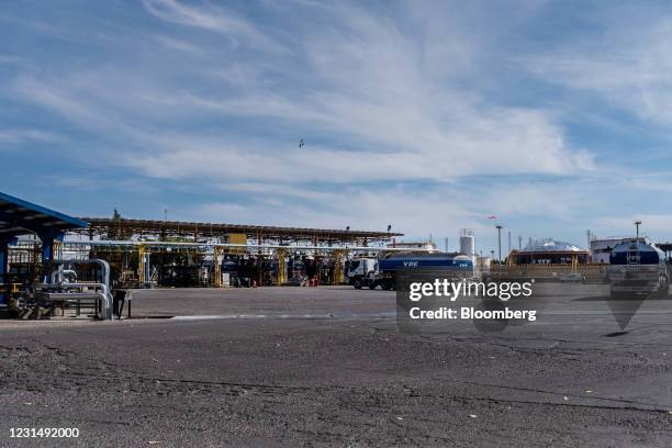 Trucks drive through a YPF SA facility in Plaza Huincul, Neuquen province, Argentina, on Tuesday, March 2, 2021. YPF, Argentinas state-run oil...