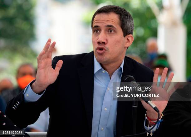Venezuelan oppositon leader Juan Guaido gestures while speaking during a press conference at the Los Palos Grandes square in Caracas on March 3,...