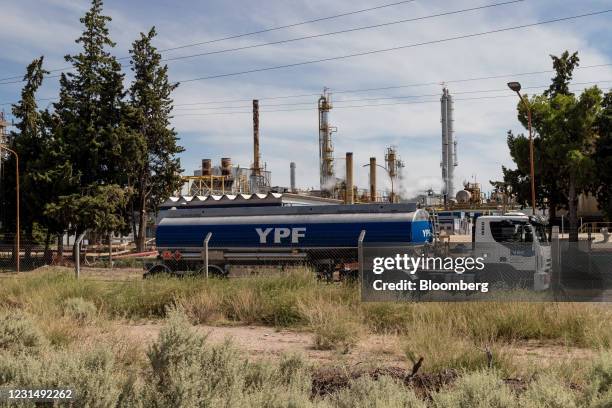 Truck passes a YPF SA facility in Plaza Huincul, Neuquen province, Argentina, on Tuesday, March 2, 2021. YPF, Argentinas state-run oil company, needs...