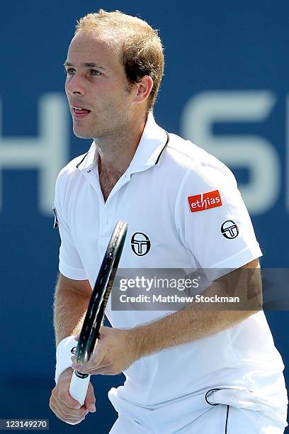 Olivier Rochus of Belgium looks on during play with Andre Sa of Brazil against Julian Knowle of Austria and Horacio Zeballos of Argentina during Day...