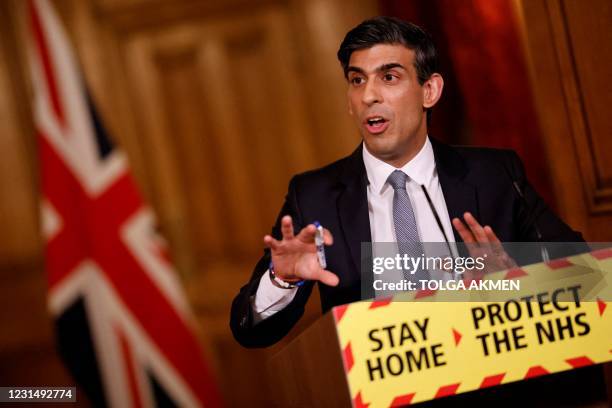 Britain's Chancellor of the Exchequer Rishi Sunak attends a virtual press conference inside 10 Downing Street in central London on March 3 following...