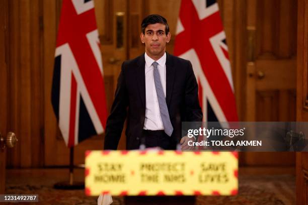 Britain's Chancellor of the Exchequer Rishi Sunak arrives to attend a virtual press conference inside 10 Downing Street in central London on March 3...