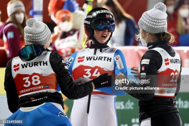 March 2021, Bavaria, Oberstdorf: Nordic skiing: World Championships, ski jumping, large hill, women, 2nd round. Maren Lundby from Norway celebrates...