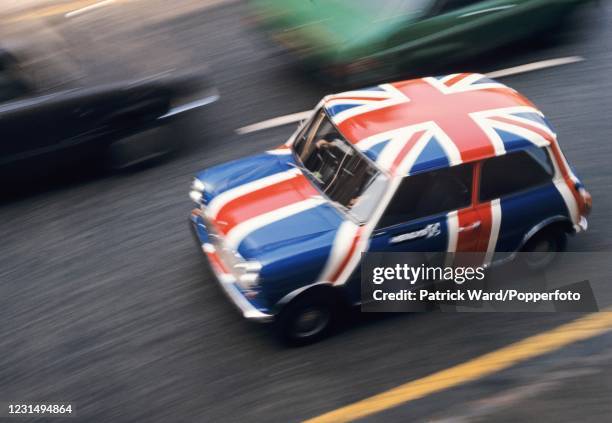Union Jack-painted Morris Mini automobile celebrating the Silver Jubilee of Her Majesty Queen Elizabeth II in London on 7th June 1977.