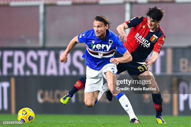 Albin Ekdal of Sampdoria and Eldor Shomurodov of Genoa vie for the ball during the Serie A match between Genoa CFC and UC Sampdoria at Stadio Luigi...